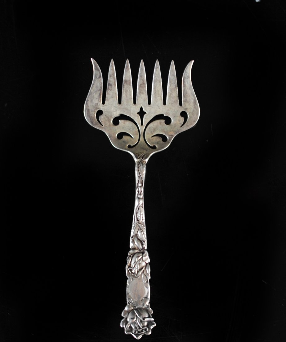 Antique Sterling Silver Caviar fork: DESCRIPTION: Antique Sterling Silver caviar fork. 7 pronged fork with clear age and oxidation, amazingly detailed with a floral motif on the handle. Hallmarked and stamped with Sterling on the back. W