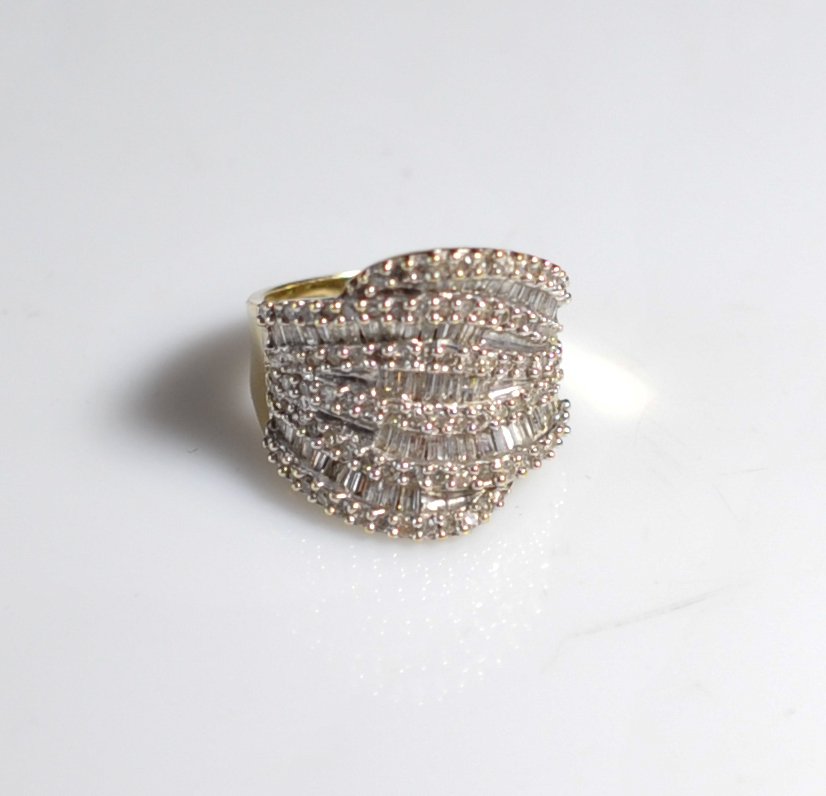 Vintage 10k Gold & Diamond Ring: DESCRIPTION: Vintage 10k yellow gold and white diamond ring. Half diamonds are round cut while the other half are baguette cut. Stamped 10k on the inside of the band. Weighing a total of 4.8 penny wei