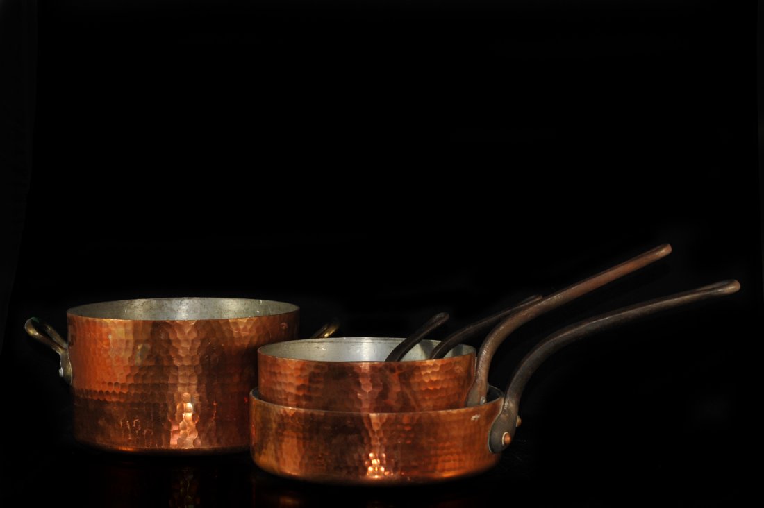Five Antique "E.Dehillerin" Hammered Copper Pots: DESCRIPTION: Lot of five antique "E.Dehillerin" hammered solid copper pots/saucepans. The interiors are tin lined. Four of the pot/saucepan handles are cast iron, the largest pot has handles made of b
