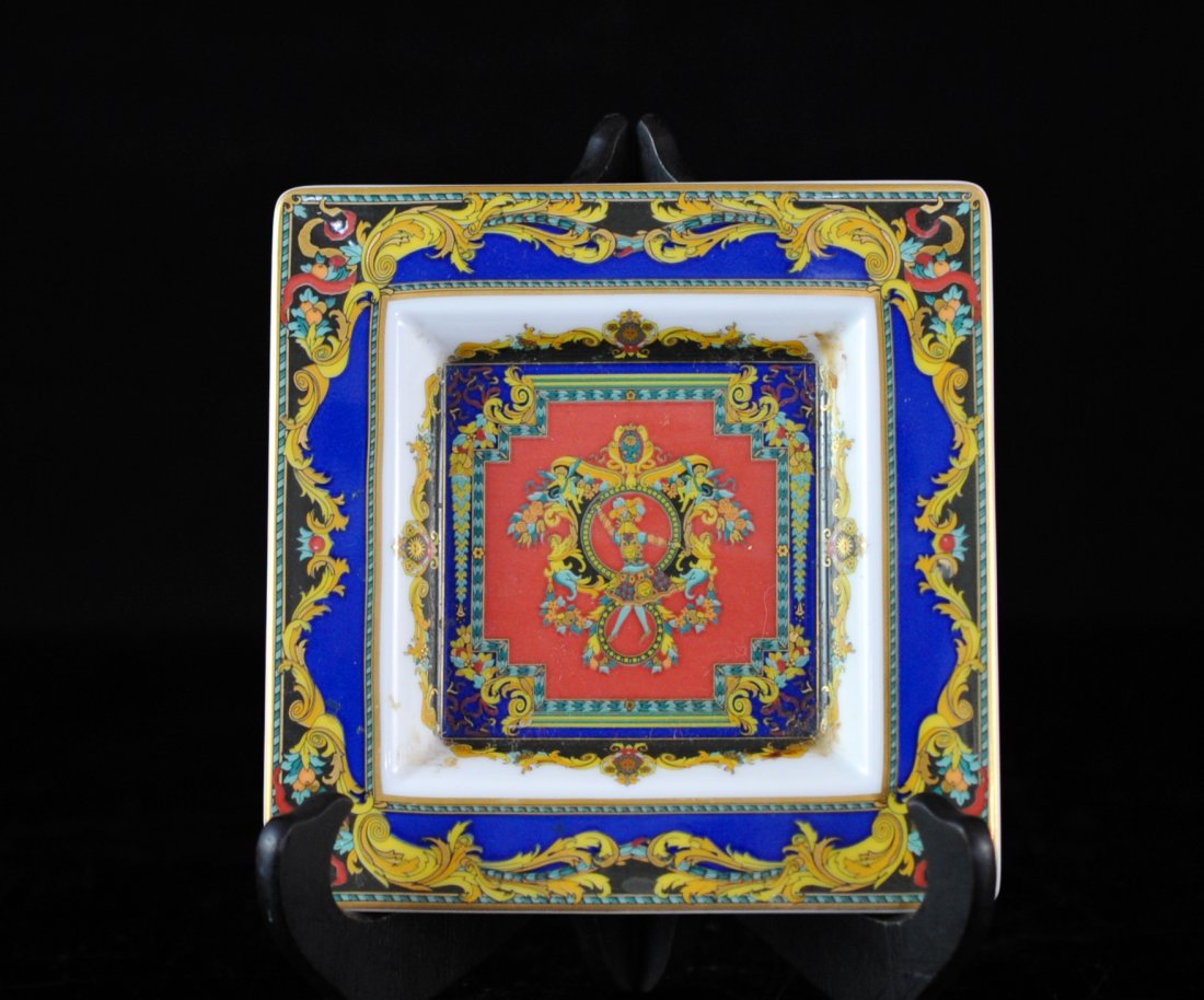 Versace Rosenthal "Le Roi Soleil" Ashtray: DESCRIPTION: Versace Rosenthal "Le Roi Soleil" ashtray features in gilded porcelain the "Le Roi Soleil" print in beautiful array of colors. Studio-Linie Marked on bottom "Rosenthal Versace" and "Germa