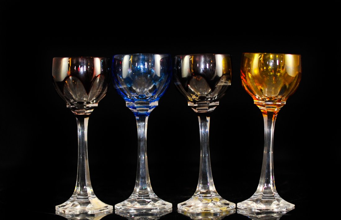 Four Piece Set Of Nachtmann Liquor Glasses.: DESCRIPTION: Four piece set of crystal Nachtmann liquor glasses. The crystal glasses feature a clear stem with the cups in an array of colors incuding red, blue, purple, and yellow. Marked "Nachtmann"
