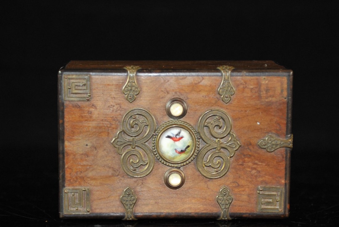 Wooden Box With Brass And Cameo Design: DESCRIPTION: Footed wooden box with brass design & cameo with hand painted birds in the center. The Interior of the box is painted red and a removable wooden tray. CIRCA: 20th Ct. ORIGIN: Unknown DIME