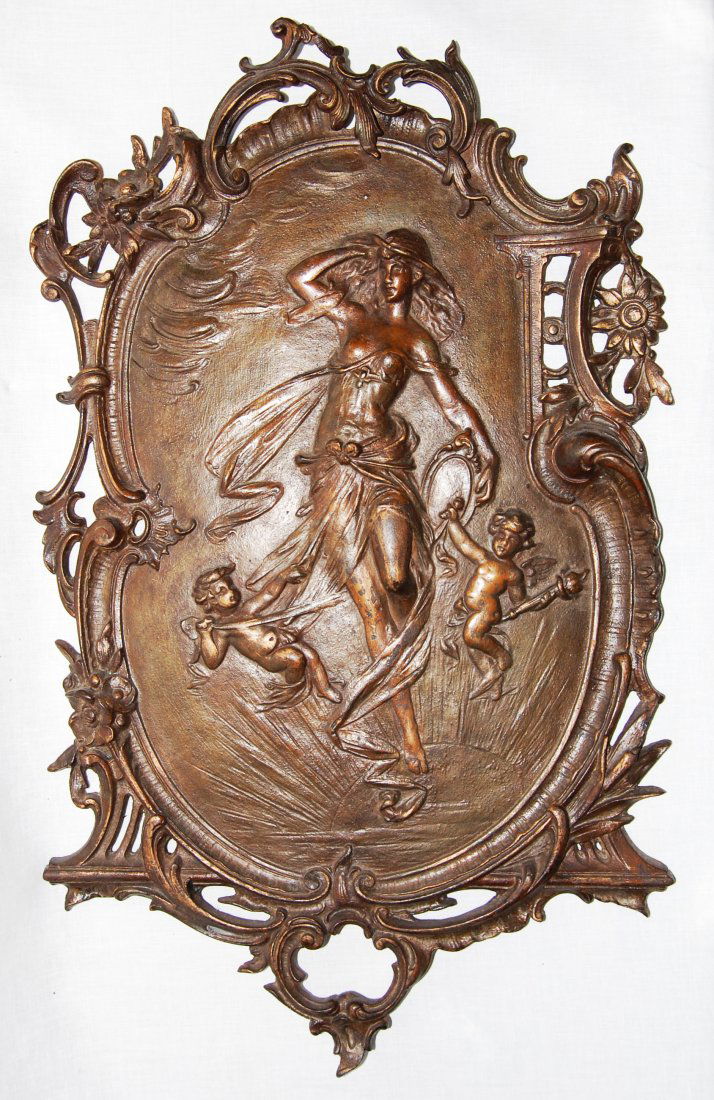 Antique Gilded Bronze Wall Plaque: DESCRIPTION: Antique gilded bronze wall hanging plaque featuring a gorgeous lady in the middle with two cherubs at her feet finished with floral motif borders, in a gorgeous 2 tone brown patina. CIRCA