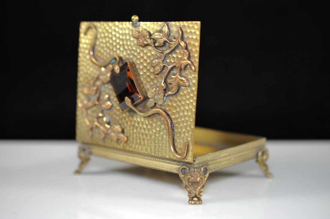 French Serpent Brass Card Case: DESCRIPTION: French serpent metal card case. Features a snake skin imprint design on the metal, branches with fruit and two raised serpents holding a giant topaz stone in place with their heads. Box s
