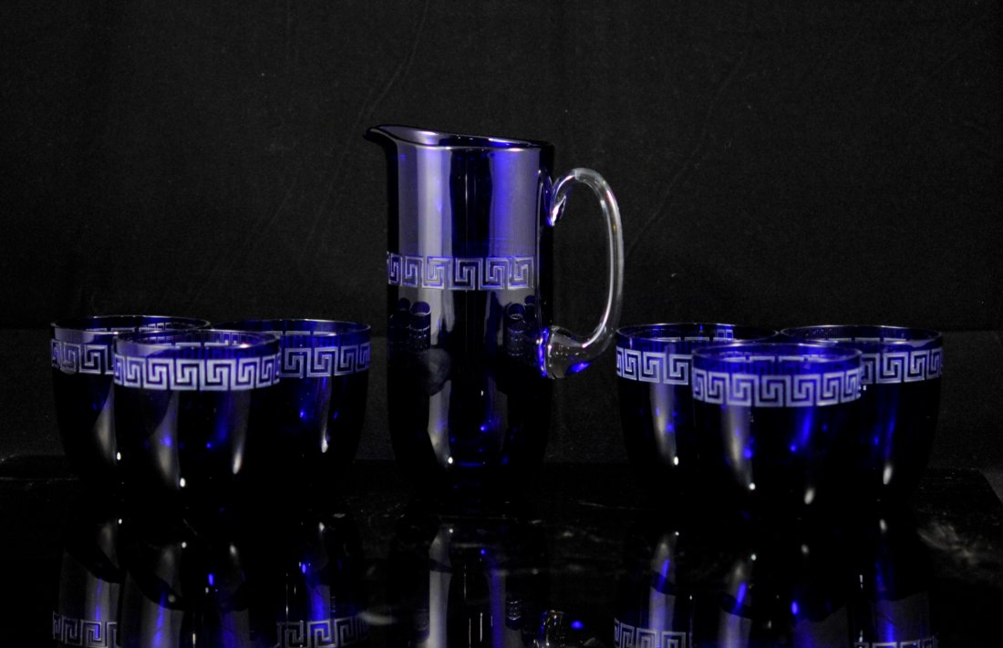 Versace "Rosenthal" Cobalt Crystal Pitcher & Cup Set: DESCRIPTION: Versace "Rosenthal" cobalt crystal pitcher and cup set. Features one large cobalt blue crystal pitcher with an applied clear crystal handle and six cobalt crystal glasses. All pieces have