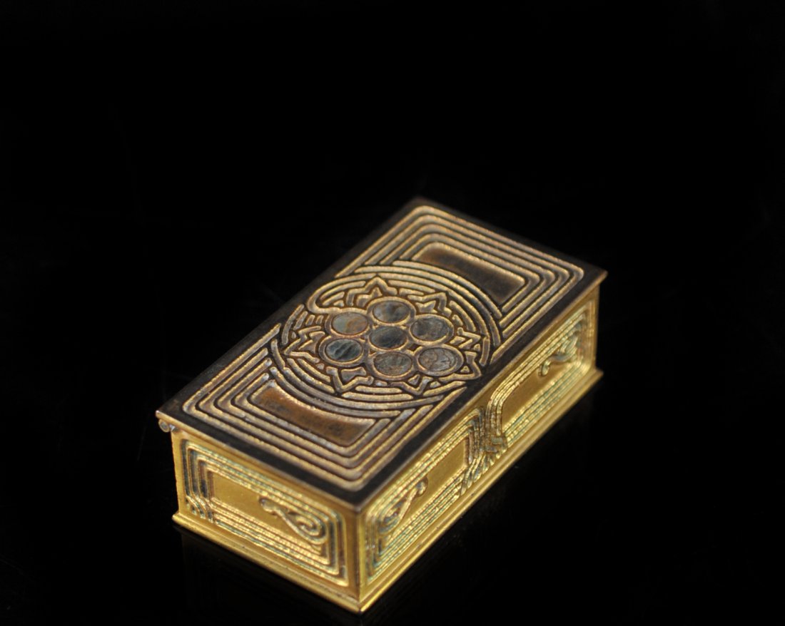 Tiffany Bronze Abolone Stamp Box: DESCRIPTION: Tiffany bronze abolone stamp box featuring incised lines through out the box and five abolone shells on lid. Marked "Tiffany Studios New York 1158". CIRCA: 20th Ct ORIGIN: U.S DIMENSIONS: