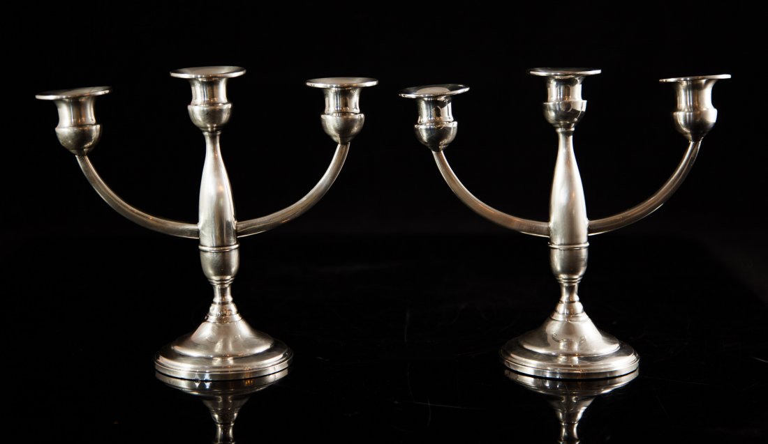 Sterling Silver Weighted Candle Stick Holders: DESCRIPTION: Pair of vintage weighted sterling silver antique candle stick holders. Hallmarked "M" "Sterling" "382" on bottom. CIRCA: 20th Ct. ORIGIN: USA DIMENSIONS: H: 7.5" L: 8"