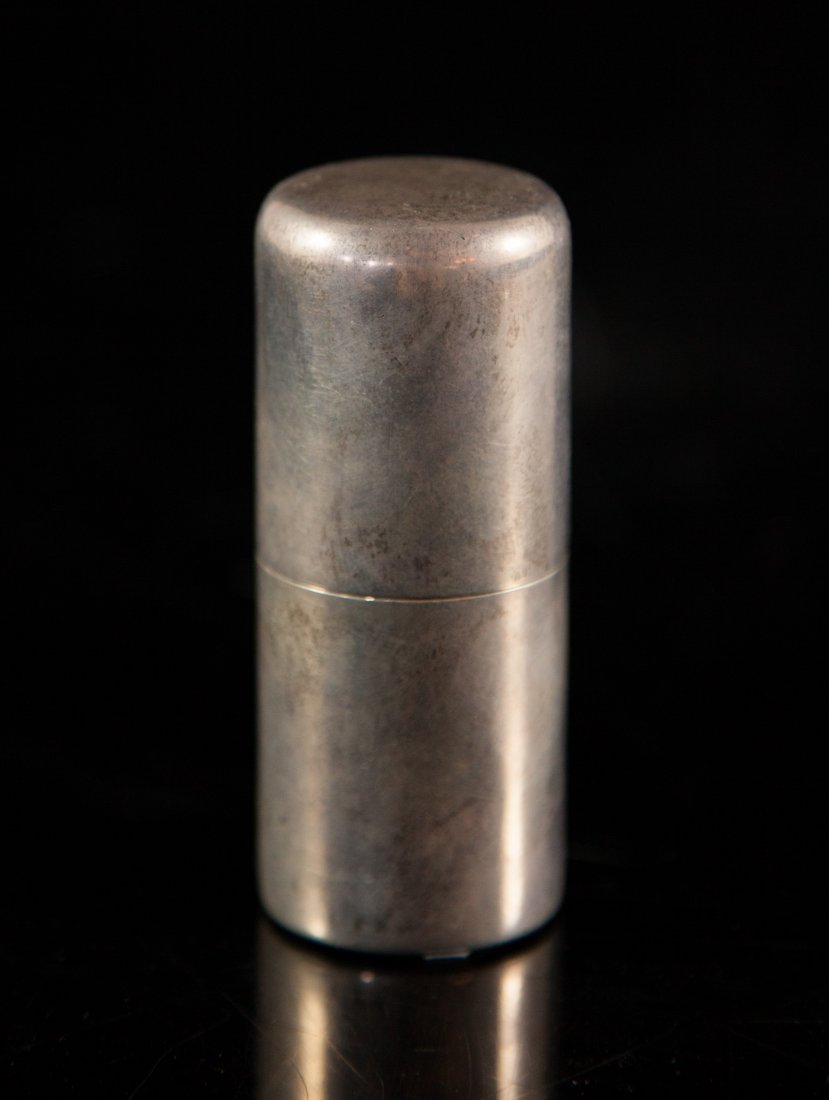 Sterling Silver Cylinder Pill Box: DESCRIPTION: Sterling Silver cylinder pill box with secure lid. Weighs a total of 55 grams. Hallmarked on the inner lid "Sterling" CIRCA: 20th ct ORIGIN: U.S DIMENSIONS: H: 3" W: 1"