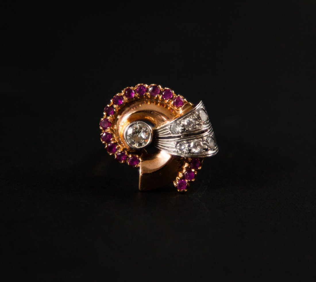 Rose Gold & Diamond Ring: DESCRIPTION: An art deco 14k rose gold ring with a .7 VS1 antique cut diamond in the middle, finished with 6 diamonds weighing approx 1.5Cts. 15 small rubbies giving it the finishing touch. CIRCA: 193
