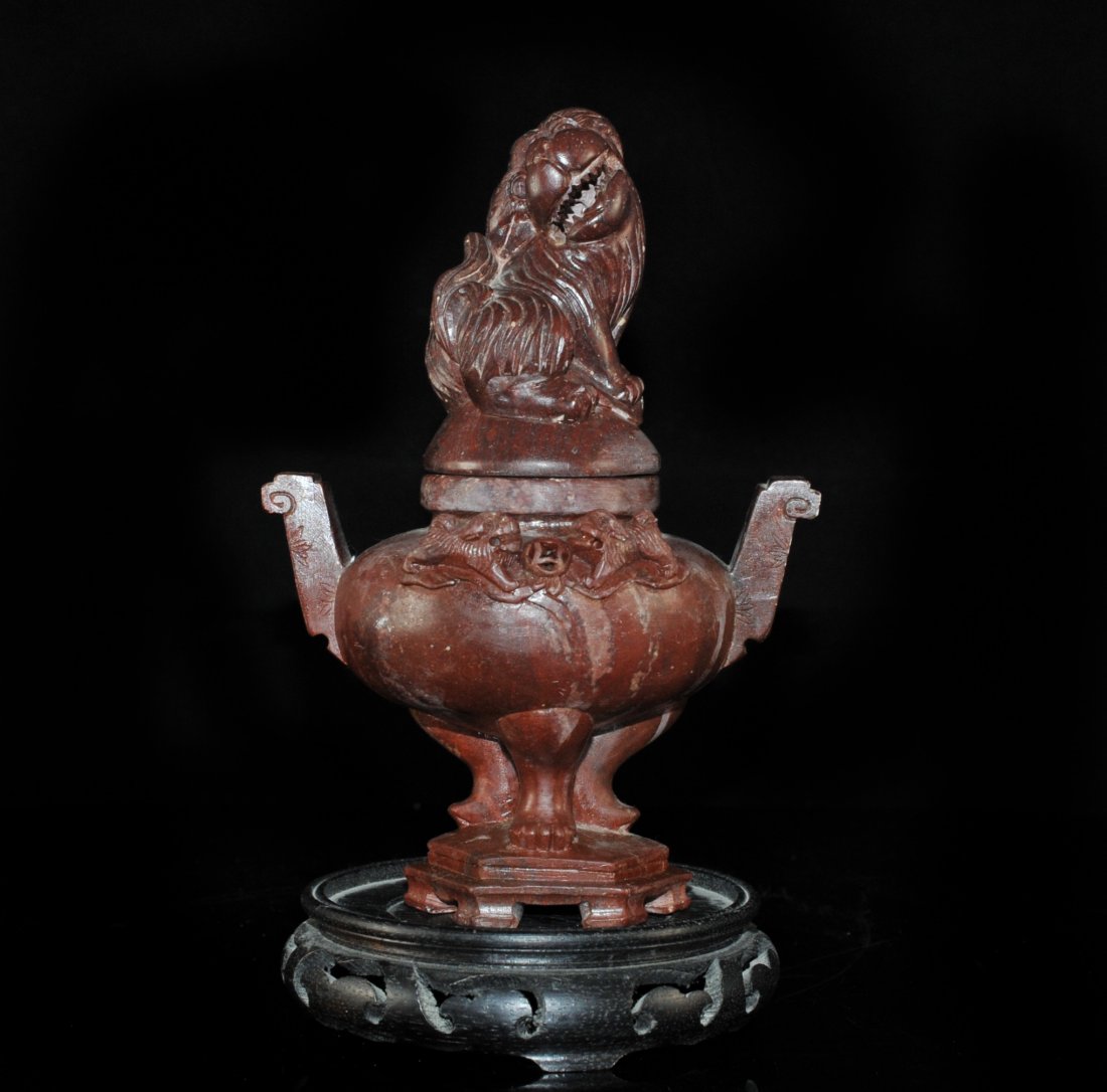Antique Chinese Soapstone Urn: DESCRIPTION: Large antique soapstone urn with detailed carving, the base has three legs as the stand, on the front side it has two small foo dogs facing each other, and the top lid is of a foo dog sit
