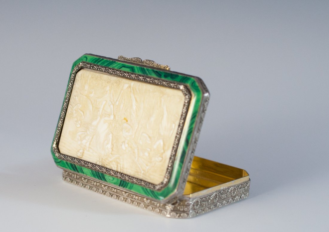 Silver & Ivory Case: DESCRIPTION: .93 silver case features an ivory plaque decorated with Roman scenes and borderd by a malachite enamel. The body of the case is covered with repousse floral designs and the interior is fi