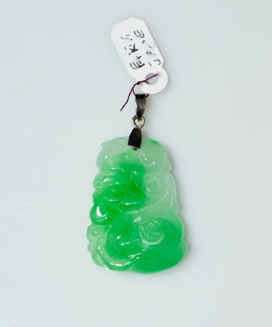Chinese Gold & Jade Pendant: DESCRIPTION: Hand carved chinese jade pendant features a color mixture of white and bright green with a translucent matrix . The jade is finished with a 14k white gold bale. CIRCA: late 20th Ct. ORIGI