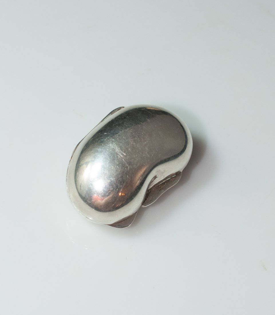 Silver Bean Pill Box: DESCRIPTION: 800 silver pill box features in a kidney bean shape with an easy open latch. Marked "800" CIRCA: 20th Ct. ORIGIN: France DIMENSIONS: L: 1.75" W: 1.5"
