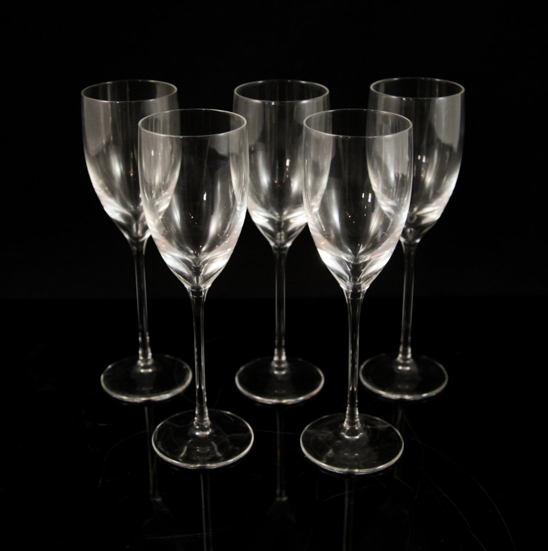 Five Daum Crystal Flutes: DESCRIPTION: Set of six crystal Daum wine cups marked on the base "Daum France". Excellent Condition CIRCA: Late 20th Ct. ORIGIN: France DIMENSIONS: H: 8" W: 2.5"