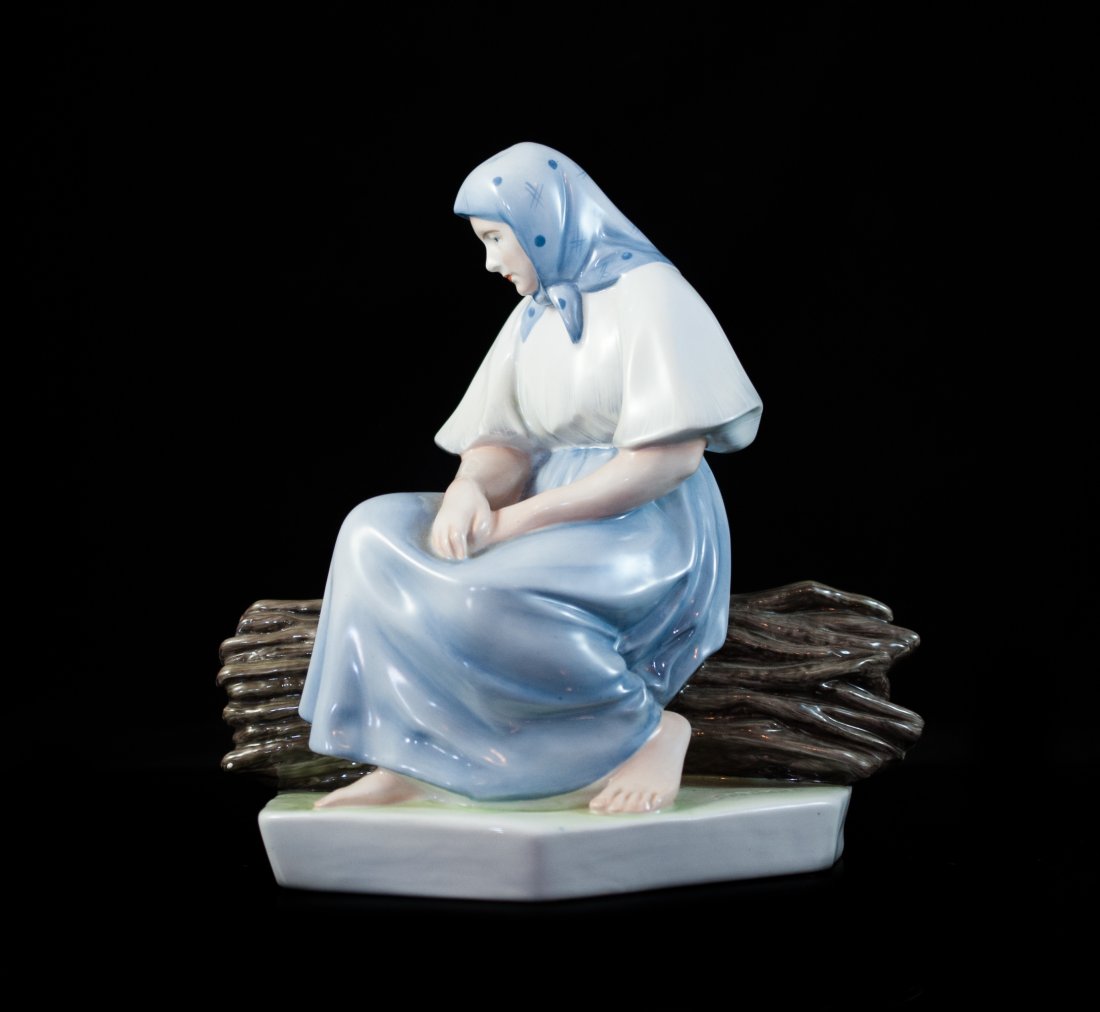 Zsolnay Handpainted Porcelain Figurine: DESCRIPTION: Zsolnay multicolored handpainted porcelain figurine features a elderly woman sitting apathetically on a tree log. Marked "Sinko" On bottom corner and "Zsolnay Hungary" on the bottom. CIRC