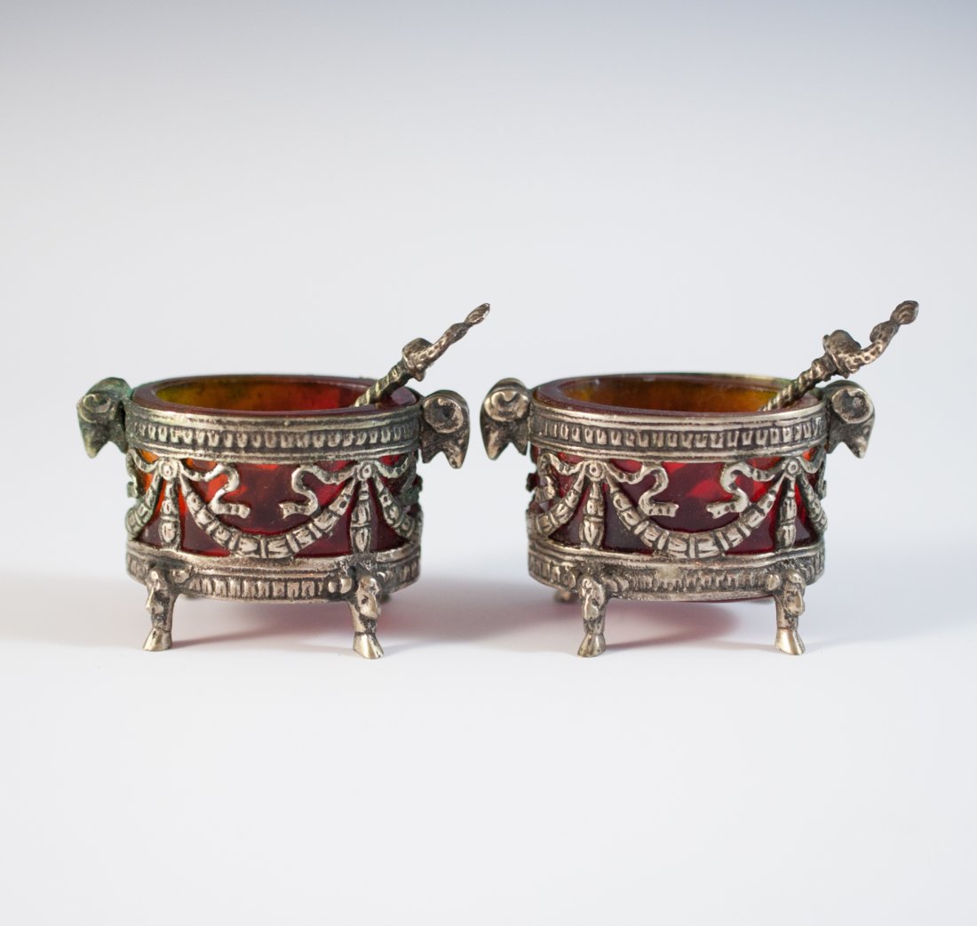Amber Glass 800 Silver Salt Cellars: DESCRIPTION: A gorgeous pair of 800 silver salt cellars with their original matching spoons. The interrior has an amber glass color, rams heads as handles and footed on four animal feet. Both marked 8