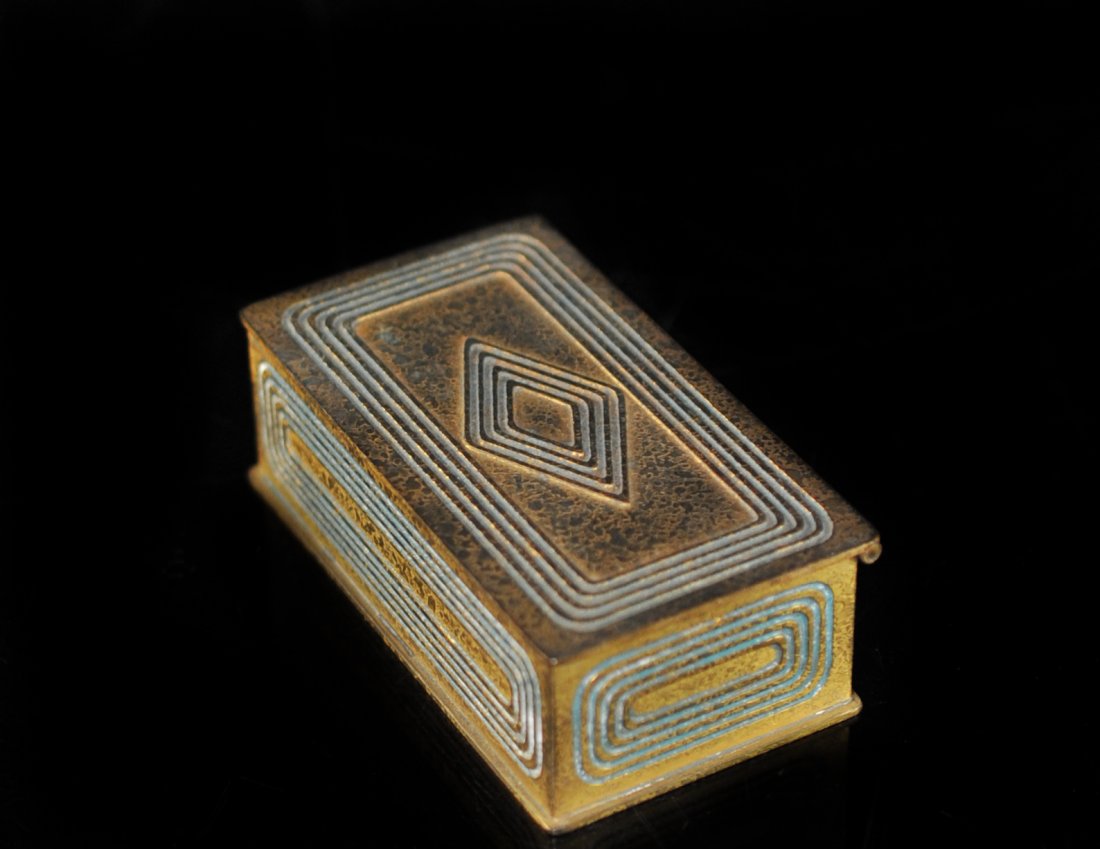 Tiffany Bronze Stamp Box: DESCRIPTION: Tiffany bronze two compartment box with flower design on lid. Marked on bottom Tiffany Studios New York 804" CIRCA: 20th Ct. ORIGIN: U.S DIMENSIONS: H: 1.5" L: 2.25"
