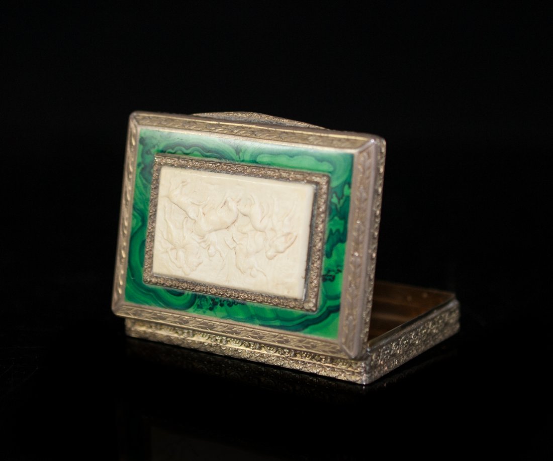 Ivory & Malachite Silver Compact Case: DESCRIPTION: Silver case features an ivory plaque decorated with Roman scenes and borderd by a malachite enamel. The body of the case is covered with repousse floral designs and the interior is finish
