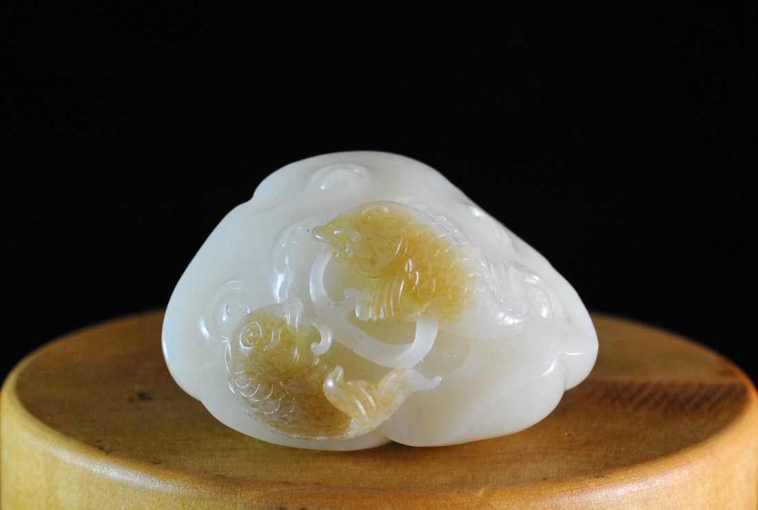 Chinese White Jade Carving: DESCRIPTION: Chinese hand carved white jade. Large chunk of jade features a bulb with a flower like motif and fish design. Has a light tint of brown skin distinguishing the fish. ORIGIN: China DIMENSI