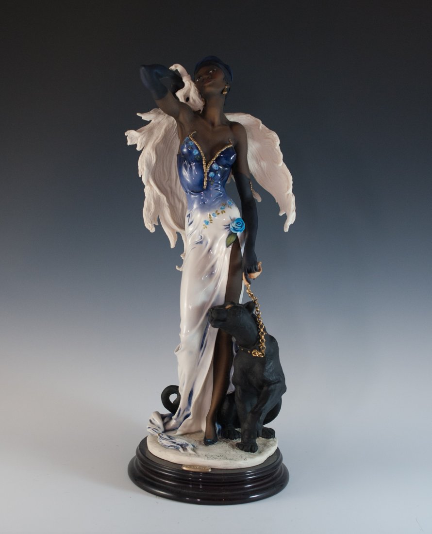 Giuseppe Armani "Night Stars" Porcelain: DESCRIPTION: Giuseppe Armani porcelain figurine Titled "Night Stars" features a woman elegantly dressed with wings and a black panther resting at her side. The piece is signed and includes a small tit