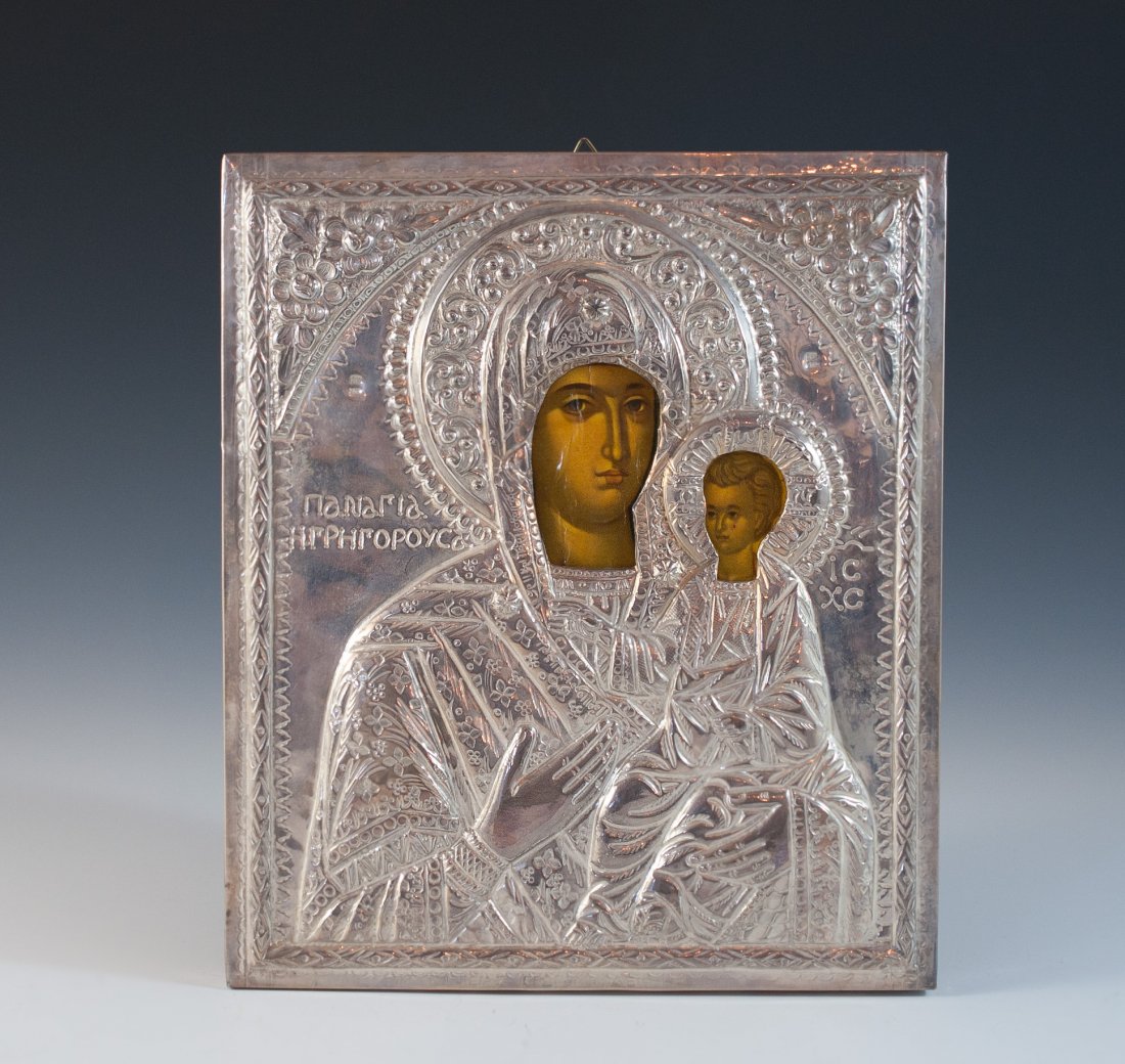 800 Silver Religious Icon: DESCRIPTION: 800 silver plaque over wood icon depicts Madonna and child, the faces are enamled while the body features in a silver filagree overlay with both figures wearing elaborate garments and cro