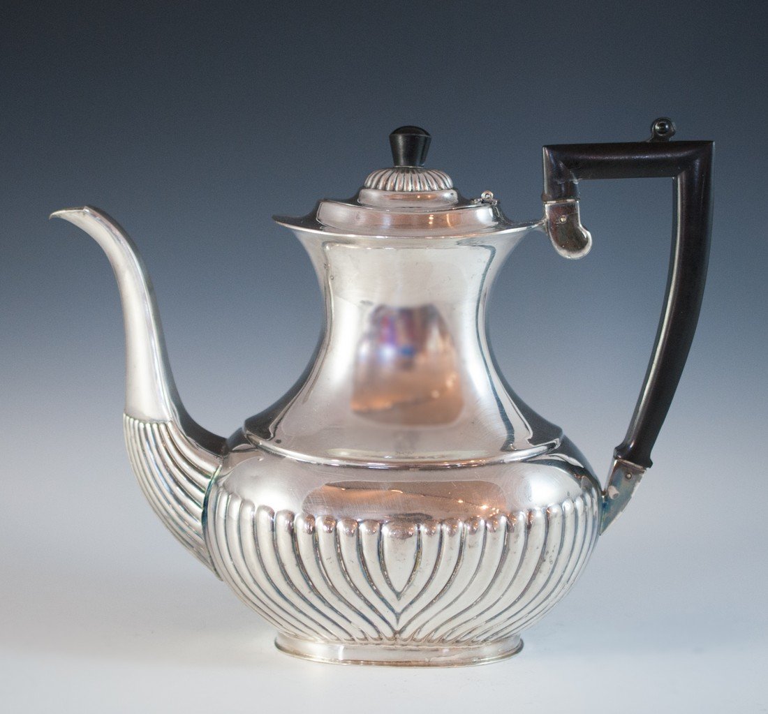 Silver Crafton Tea Pot: DESCRIPTION: Vintage, Silver plated teapot in the queen Anne style, popular in the Edwardian Era, Beautifully made the bottom , spout and lid with a fluted pattern with Ebony handle and finial. Marked