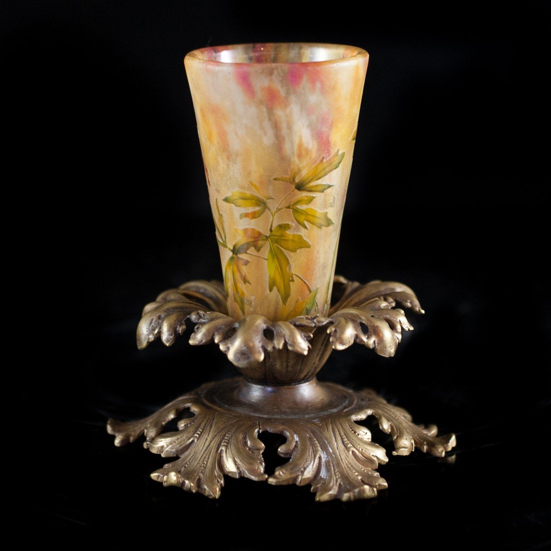 Daum Nancy Cameo Glass Vase: DESCRIPTION: Antique Daum Nancy cameo glas vase hand paintied in a multi color floral design. Gilded on to a bronze base. Signed Daum Nancy along the body. CIRCA: Early 20th ct ORIGIN: France DIMENSIO