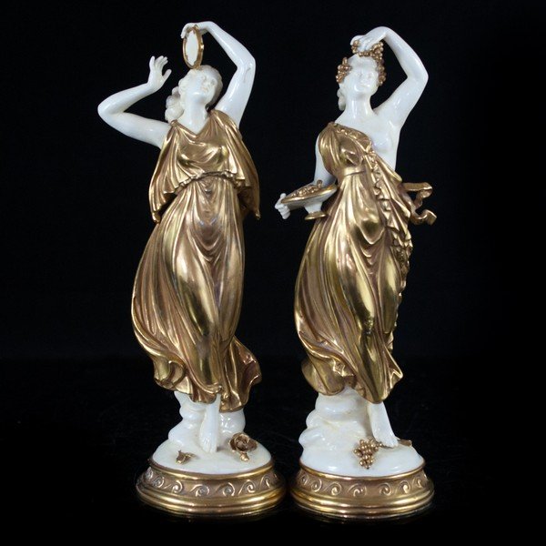 Volkstedter Two-Tone Figurines: Stunning pair of two-tone Volkstedter figurines styled with clear Green inspiration. One carries grapes in abowl and he rhand overhead, and also ornately decorated in her hair while the other dances w