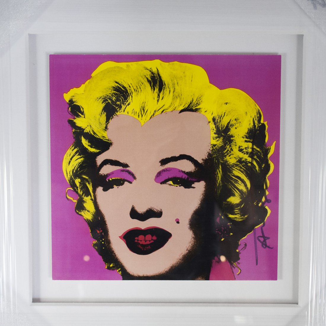 Andy Warhol "Marilyn" Print: DIMENSIONS: Hand signed print by Andy Warhol of Marilyn Monroe in vibrant hues of pink and yellow. Published by Castelli Graphics on November 21st through December 22nd 1981 with authentification plac