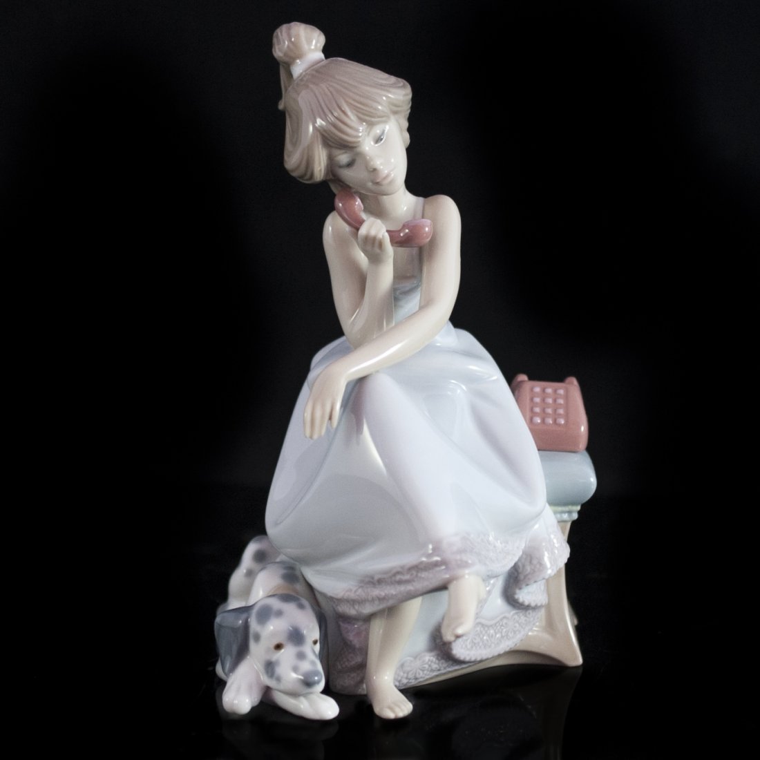 Lladro of Girl and Dalmatian: DESCRIPTION:Lladro figurine of a young girl on the phone with her dalmation by her side. Marked on bottom: "Lladro VGR 80 Handmade in Spain Daisa 1987" Left thumb has been broken off. CIRCA:20th ORIGI
