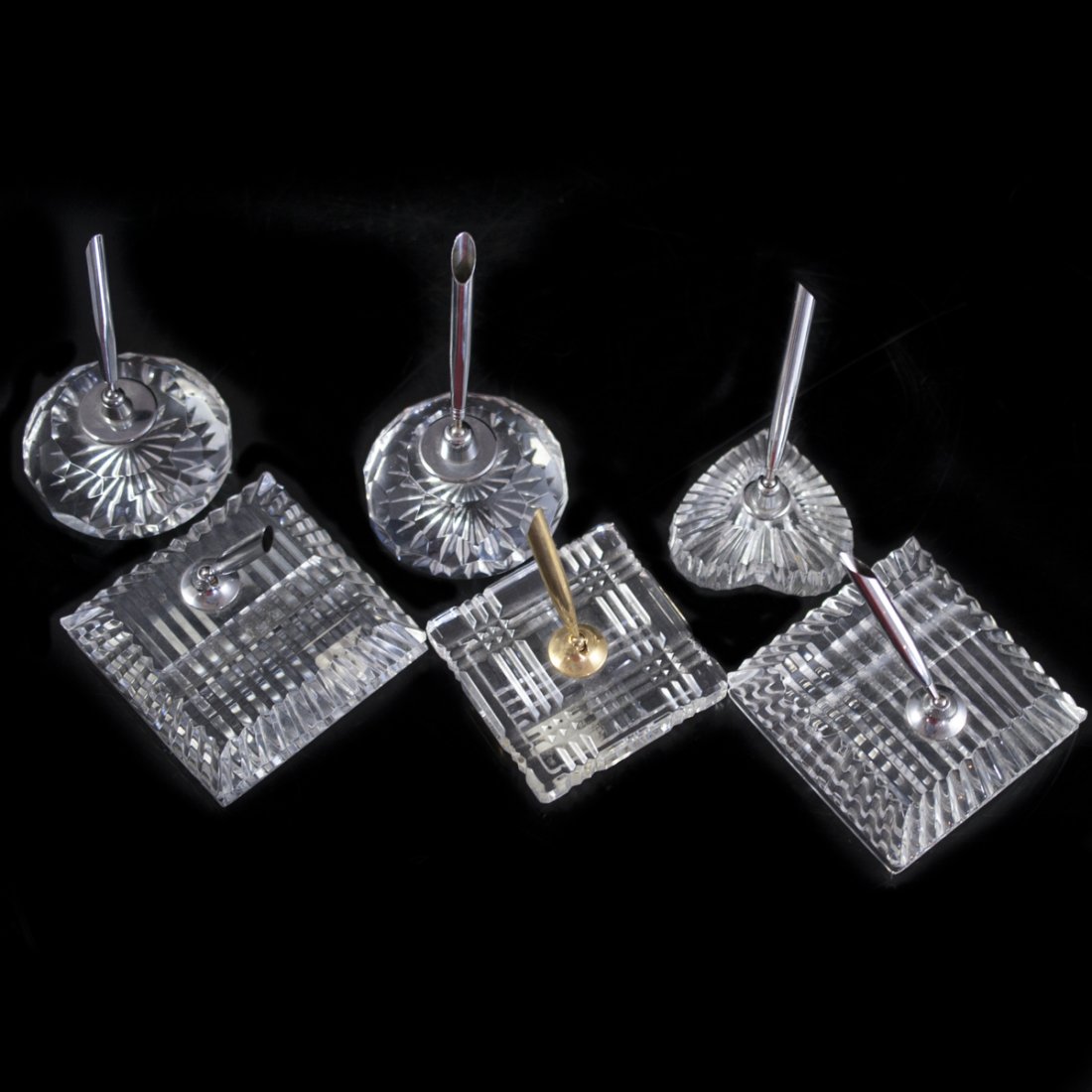 Waterford Crystal Pen Holders: DESCRIPTION:Lot of 6 Waterford crystal pen holders. Features two square pen holders with two beveled pen apertures, one hear shaped, two faceted circular pen holders, and onne swaure en holder with in