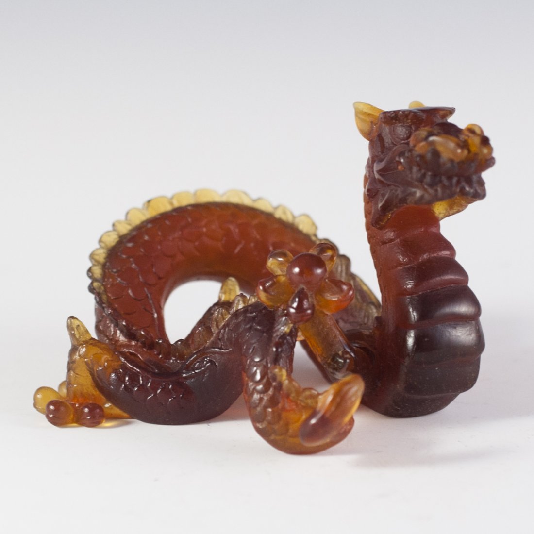 Daum Pate De Verre Crystal Dragon: DESCRIPTION:Daum pate de verre crystal dragon. Features a mythical fierce dragon clutching a ball and finished in an amber color. Marked:"Daum France" and one leg has been repaired. CIRCA:20th Ct. ORI