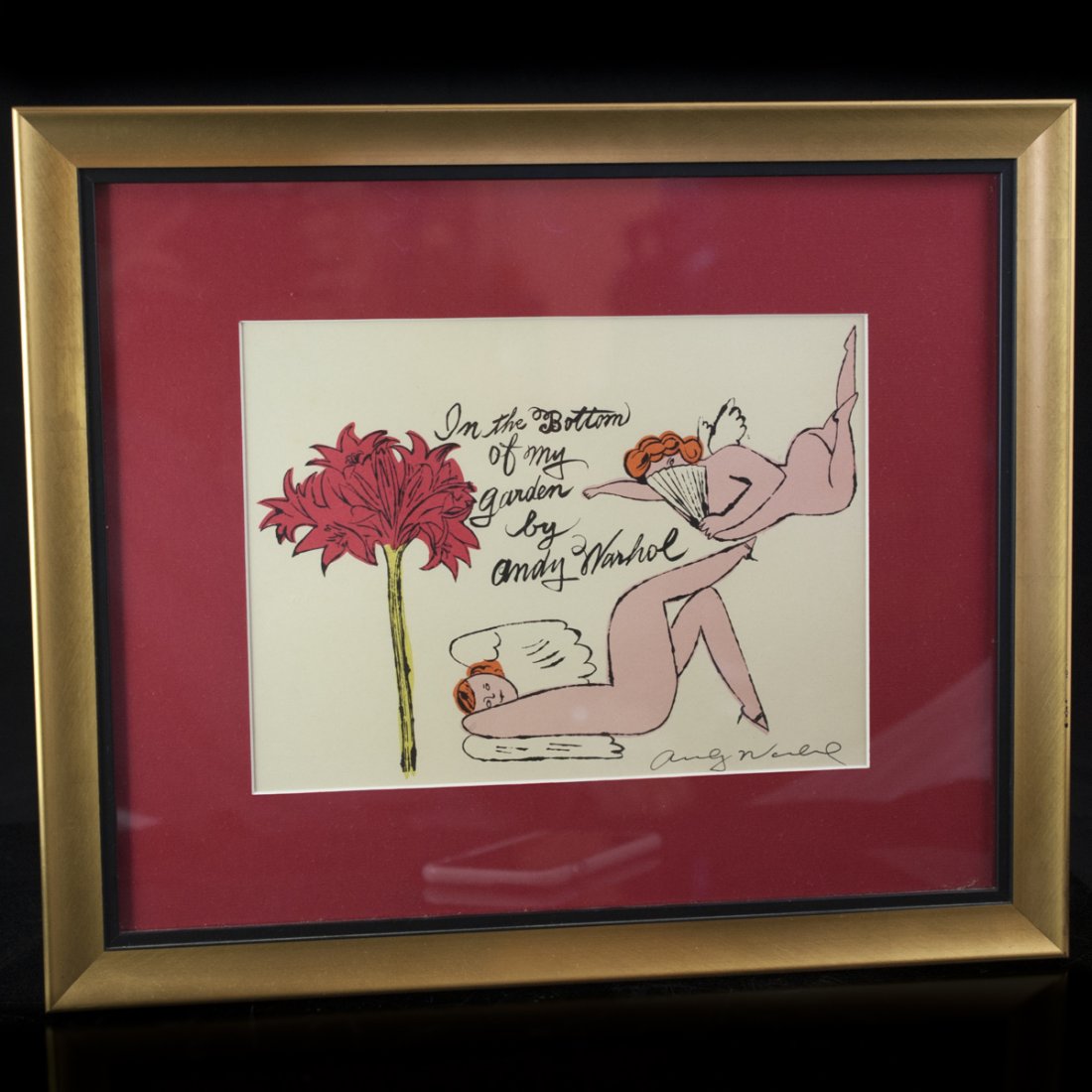 Andy Warhol Print "In the Bottom of My Garden": DESCRIPTION:Andy Warhol print illustrating two nude feminine angels and a flower. Reads: "In the Bottom of my Garden By Andy Warhol" and signed on the lower right hand side. Finished in a gilded frame