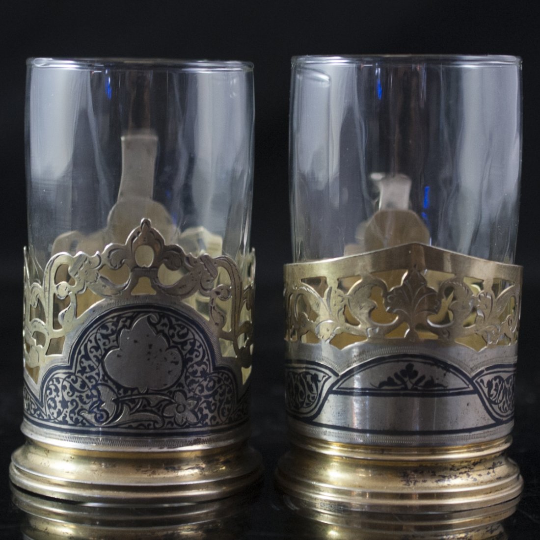 Russian Silver Cups: DESCRIPTION:Russian silver cups featuring crystal glasses with hammered finish and silver bases with engraved floral illustrations and reticulated finish. Marked with Soviet hallmarks and :"875 AX" CI