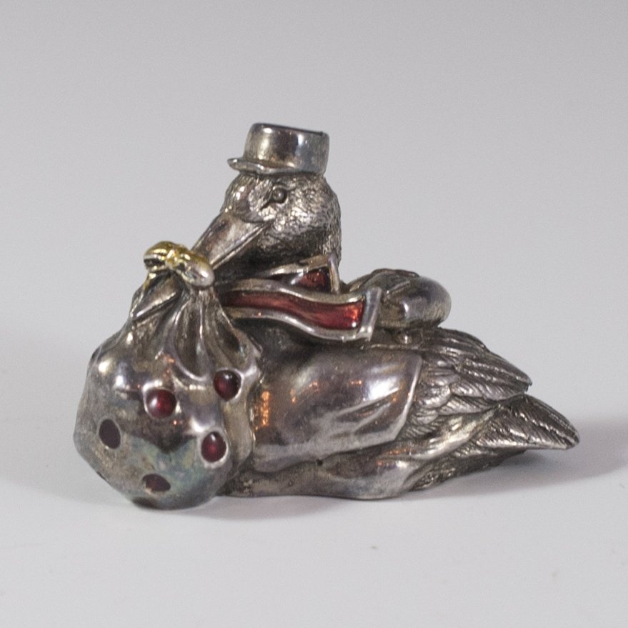 Alessandro Magrino Enameled Sterling Duck Figurine: DESCRIPTION:Sterling duck figurine wearing a hat and clothing while holding a knapsack in its beak. Finished with ruby red enamel detailings and marked:"Magrino 925" along with illegible marks. CIRCA: