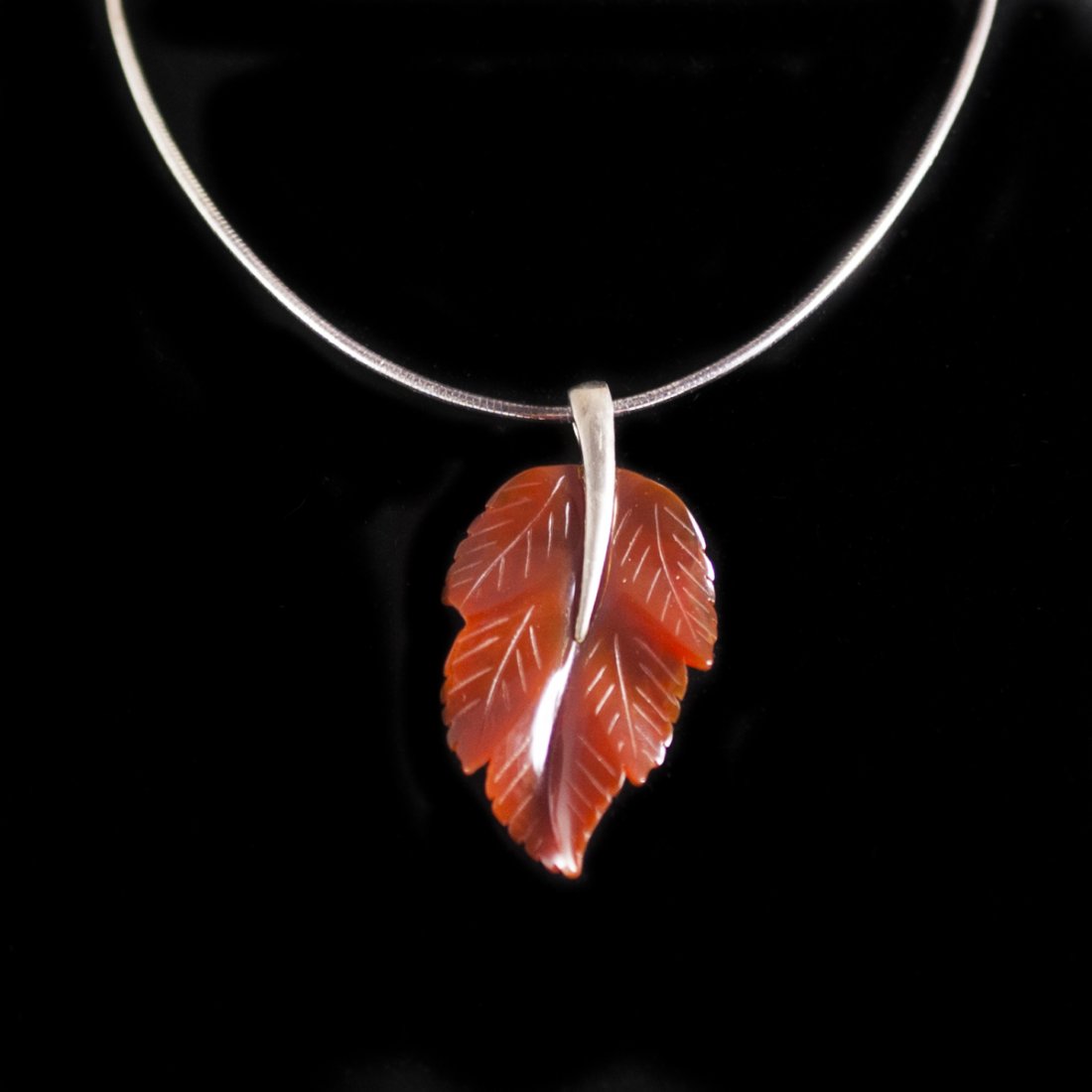 Milor Sterling Necklace & Carnelian Pendant: DESCRIPTION:Milor sterling necklace featuring a segmented sterling chain and a sterling pendant with a hanging carved carnelian autumn leaf motif pendant. Marked:"Milor 925 Italy" CIRCA:20th Ct. ORIGI