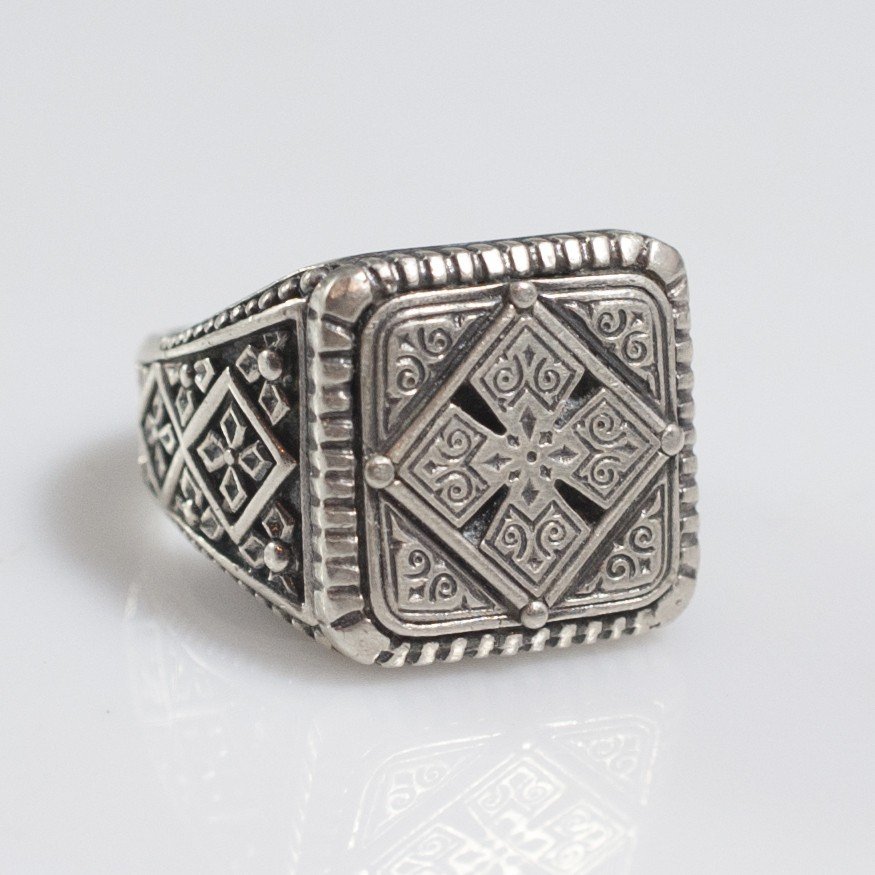 Konstantino Sterling Ring: DESCRIPTION:Sterling ring by Konstantino. Comprises of engraved filigree embellishment of gothic swirled designs and patterns along the band and bezel. CIRCA:20th Ct. ORIGIN:Greece DIMENSIONS:Ring Siz