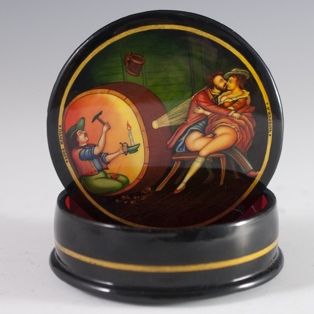 Erotic Russian Lacqeured Papier Mache Box: DESCRIPTION: A handpainted erotic Russian lacquered papier mache box. Top features a rendering of Pushkin frolicing with a Royal girl as a man illuminates the scene in a small crevice. Marked in Russi