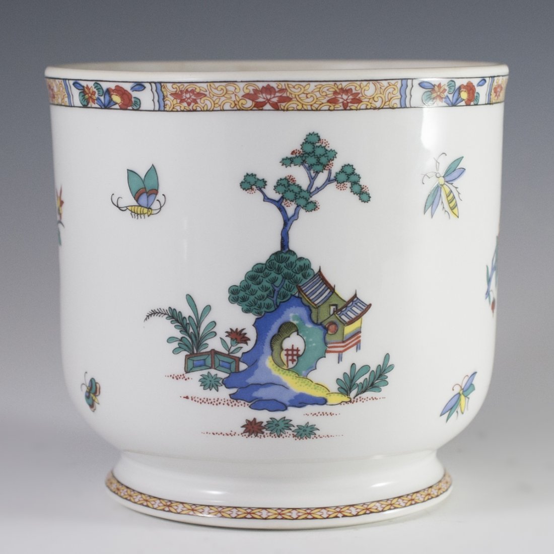 Bernardaud & Co. Limoges "Pak-Hoi" Cachepot: DESCRIPTION: Bernardaud & Co. Limoges "Pak Hoi" patterned cachepot. Features handpainted renderings of traditional Eastern villiages, along with flying moths, and blooming flowers. Marked on bottom:"
