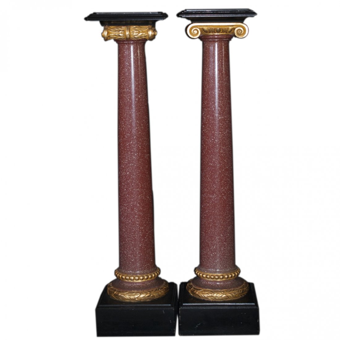 Marble Gilded Wood & Composite Pedestals: DESCRIPTION: Pair of pedestals comprising of a black marble top, surrouned by ebonized wood, resting atop gilded wooden scrolled columns with composite stems, made to look as red marble, followed by f