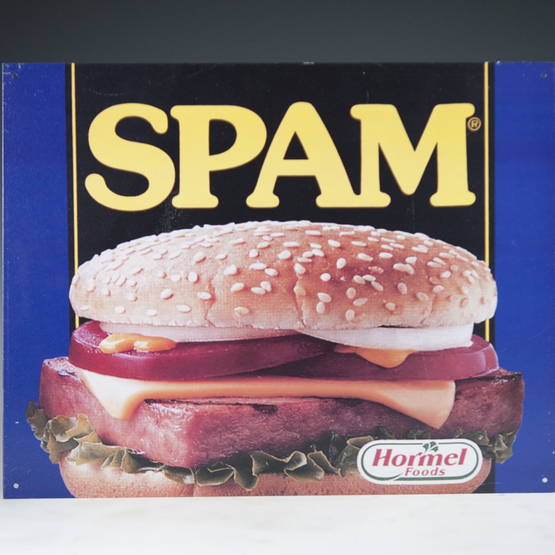 Spam Aluminum Sign: DESCRIPTION: A decorative Spam aluminum advertisement sign. CIRCA: 20th Ct. ORIGIN: USA DIMENSIONS:H:12.5" L:16" CONDITION: Great condition. See lot description for details on item condition. More det