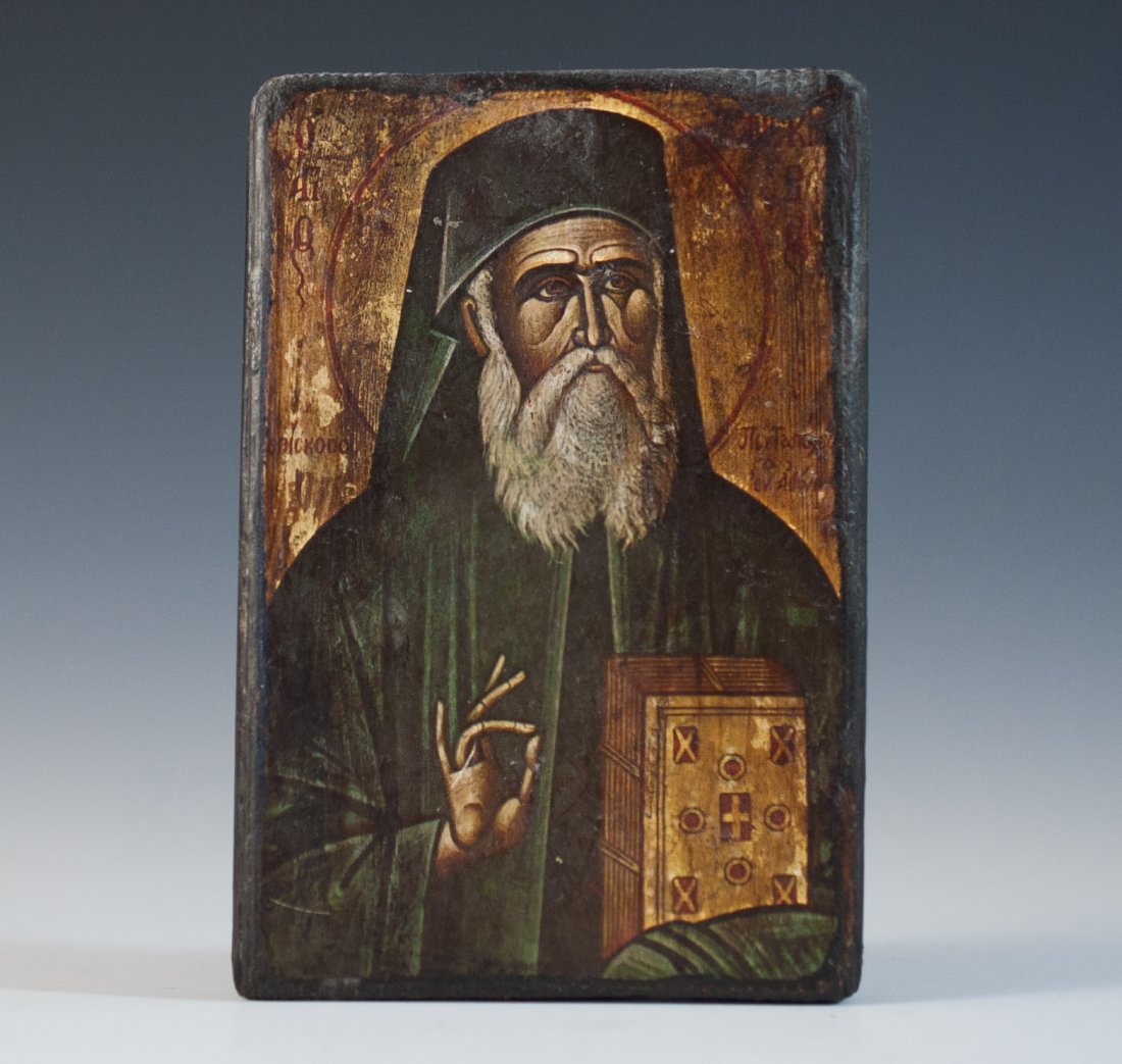 Religious Wood Icon: DESCRIPTION: Religious wooden icon painted over depicting classic portrayal of Saint John clutching a Bible. CIRCA: Early 20th Ct. ORIGIN: Greece DIMENSIONS: H: 4" L: 5" CONDITION: Good Condition. See