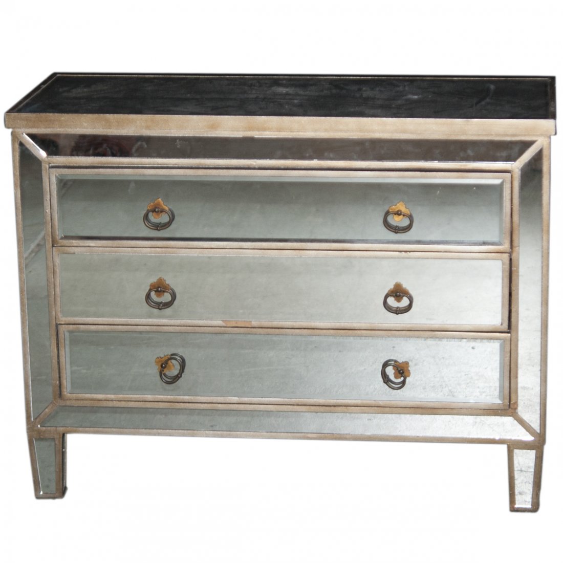 Mid-Century Wooden Mirror Dresser: DESCRIPTION: A Mid-Century dresser embellished with beveled mirror panels along the exteriors. Fitted with three pull drawers with dual ring handles. CIRCA: 20th Ct. ORIGIN: Unknown DIMENSIONS:H:29" L