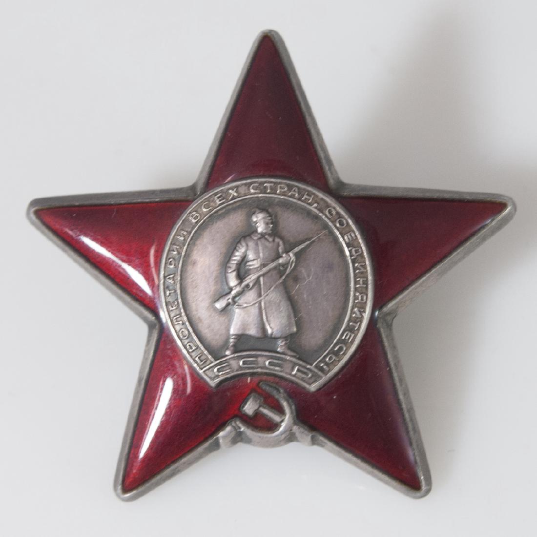 Soviet Order of the Red Star Medal: DESCRIPTION: A Soviet Order of the Red Star Medal. Awarded to Red Army and Navy personnel for exceptional service in the cause of the defence of the Soviet Union in both war and peace. Also awarded fo
