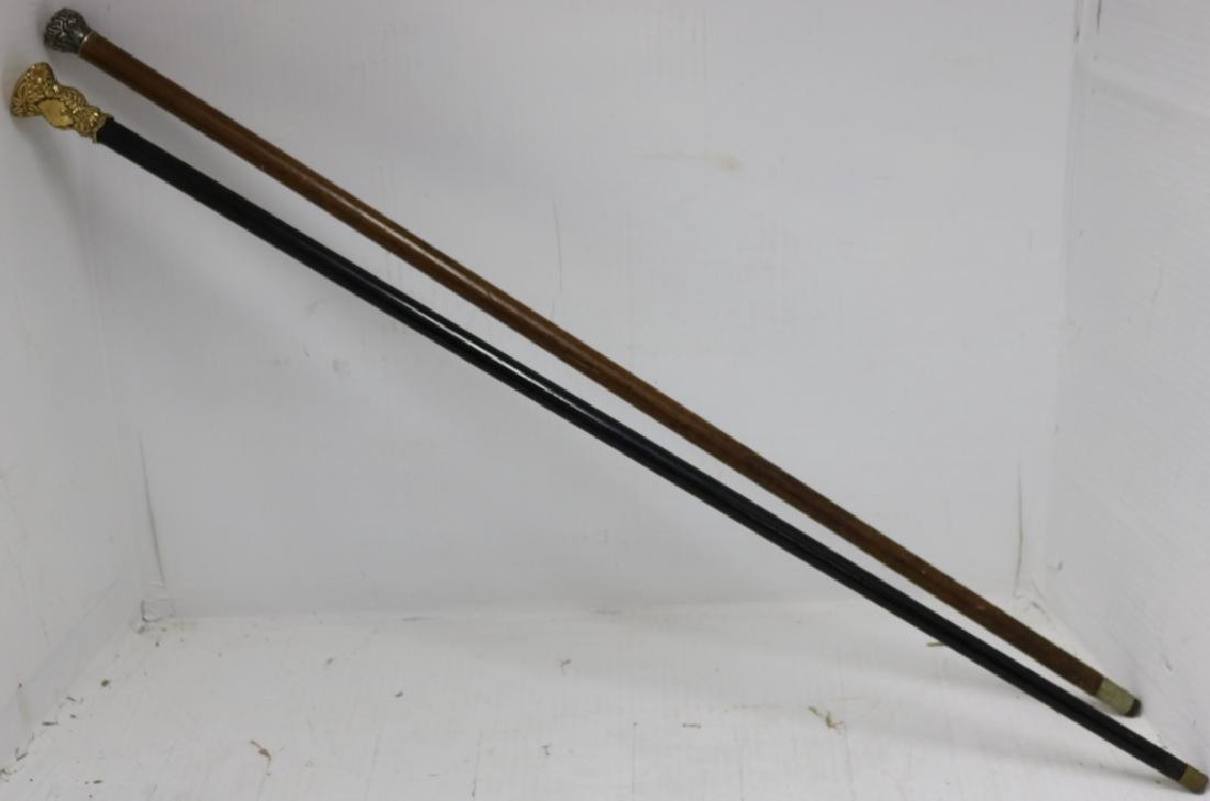 TWO 19TH C CANES RELATED TO MARTHA'S VINEYARD.: ONE HAS GOLD FILLED TOP AND EBONY SHAFT. BELONGED TO JOHN CROH, LIEUTENANT OF POLICE, 1888. 35 3/4" LONG. THE OTHER HAS STERLING TOP AND WOODEN SHAFT. BELONGED TO FRANK TILTON, SQUIDNOCKET, MARTHA'S V
