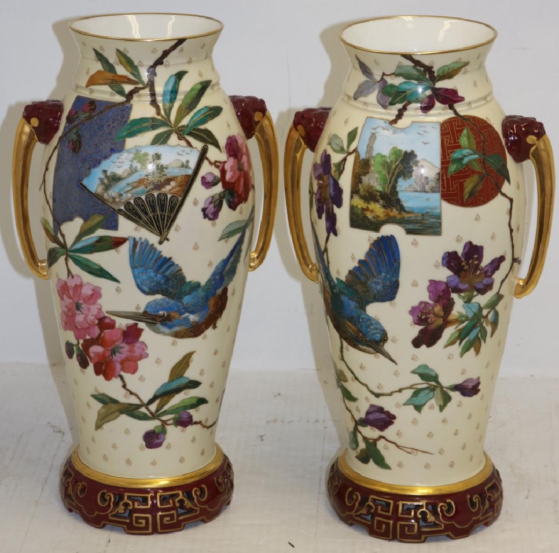 PAIR OF CONTINENTAL PORCELAIN VASES, JAPANESE: DESIGN, GILT FIGURAL HANDLES, 17 1/4" TALL, GOOD CONDITION. PROVENANCE: FAIRHAVEN COLONIAL CLUB.