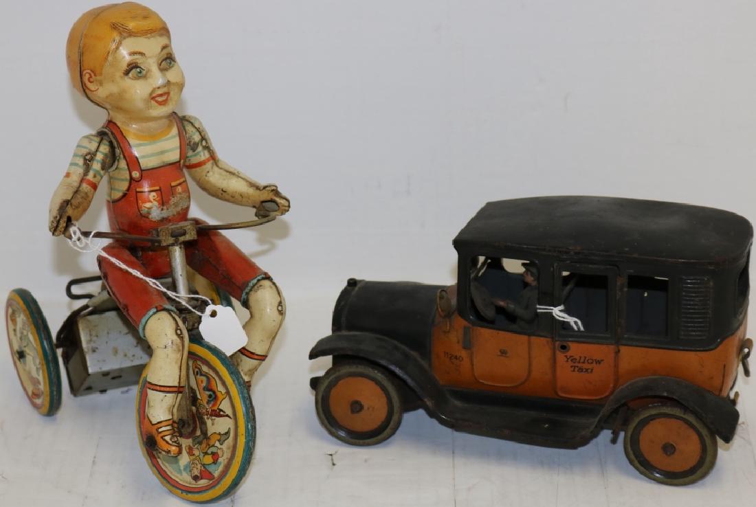 2 TOYS TO INCLUDE EARLY 20TH C GERMAN LITHO,: 4 1/2" HIGH, 8" LONG, TIN CAR, ORIGINAL PAINT, NOT WORKING, NO KEY. ONE DOOR HANDLE AND SPARE TIRE MISSING. ALONG WITH A TIN LITHO "KIDDY CYCLIST" BY UNIQUE ART, WORKING CONDITION. 8 1/2" HIGH, 7 1/2"