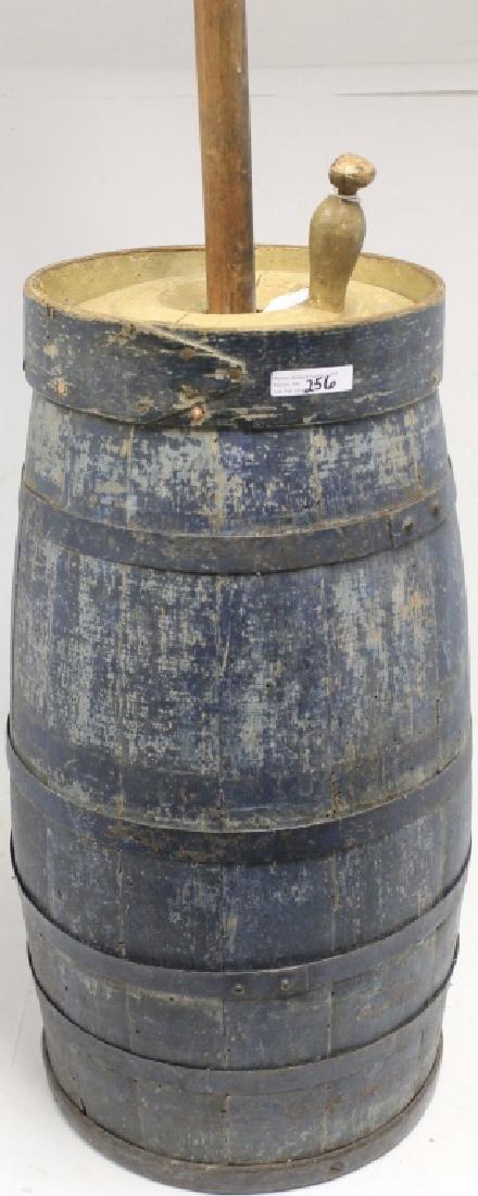 19TH C WOODEN BUTTER CHURN IN OLD BLUE PAINT.: IRON AND WOOD BANDS. CHURN 21" HIGH, OVERALL 44 1/2" HIGH, 11" DIAMETER.