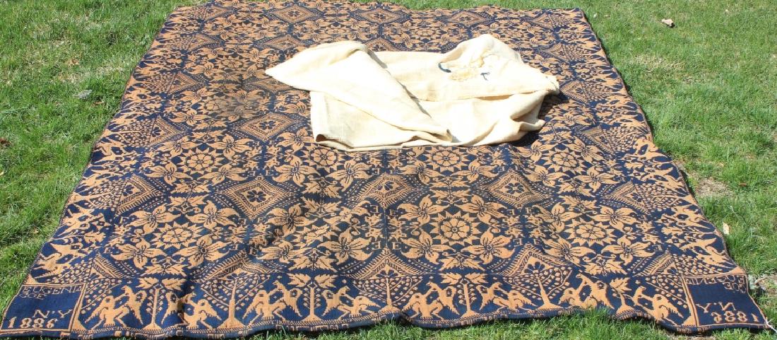 TWO 19TH C TEXTILES TO INCLUDE A SUMMER WINTER: COVERLET SIGNED EUGENIE COE, NEW YORK 1886. 69" X 89 1/2". SHOWS STAINING AND DISCOLORATION, EAGLE BORDER. EARLY HOMESPUN, DOUBLE LOOM BLANKET SIGNED N.C. WITH PARTIAL NEEDLEWORK. SHOWS HOLES AND STAI
