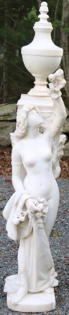 FORTUNATO GALLI (1850-1918, ITALY) LARGE ITALIAN: MARBLE SCULPTURE OF A NUDE MAIDEN POSSIBLY VENUS. SIGNED ON BACK AND DATED 1906. THE PIECE HAS RESTORATION TO ARM, FINGER AND URN. BROKEN AND REATTACHED. REPAIR IS EXCELLENT AND IS NOT VISIBLE. 66" HI